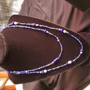 Royal blue, white, black glass and silver beads. 20inch drop necklace.